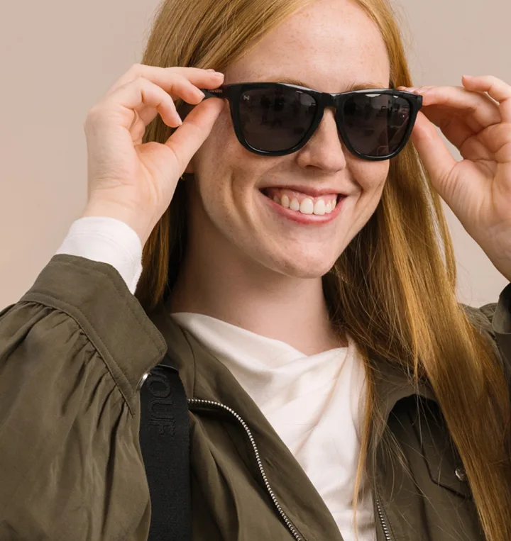Woman smiling in sunglasses