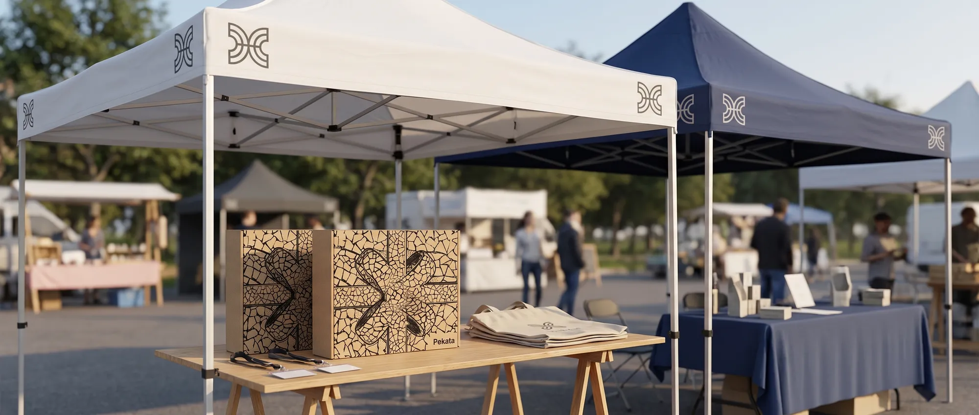 3x3 metre foldable gazebo with the roof and valance printed with a company's logo at an outdoor trade show